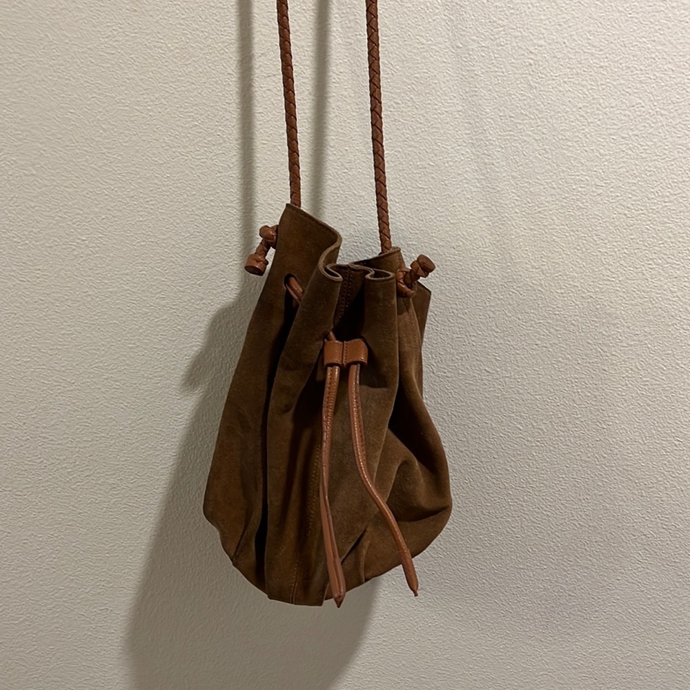 Suede boho satchel bag with woven strap.